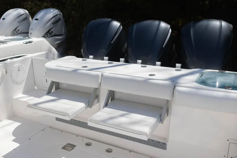 Slide: The Image of 2015 Everglades 355 Center Console with Yamaha outboard engines and foldable seating. - 24