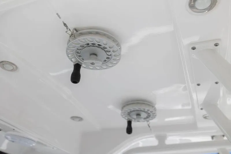 Slide: The Image of 2015 Everglades 355 Center Console boat ceiling with mounted fishing reel handles. - 30