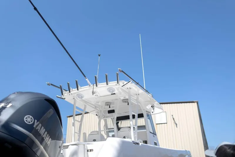Slide: The Image of 2015 Everglades 355 Center Console boat with Yamaha engine against clear blue sky. - 5
