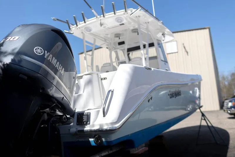 Slide: The Image of 2015 Everglades 355 Center Console boat with Yamaha engine, docked outdoors. - 6