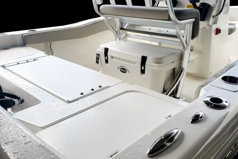 Slide: The Image of 2025 Key West 179 FS boat interior with seating and storage compartments. - 6