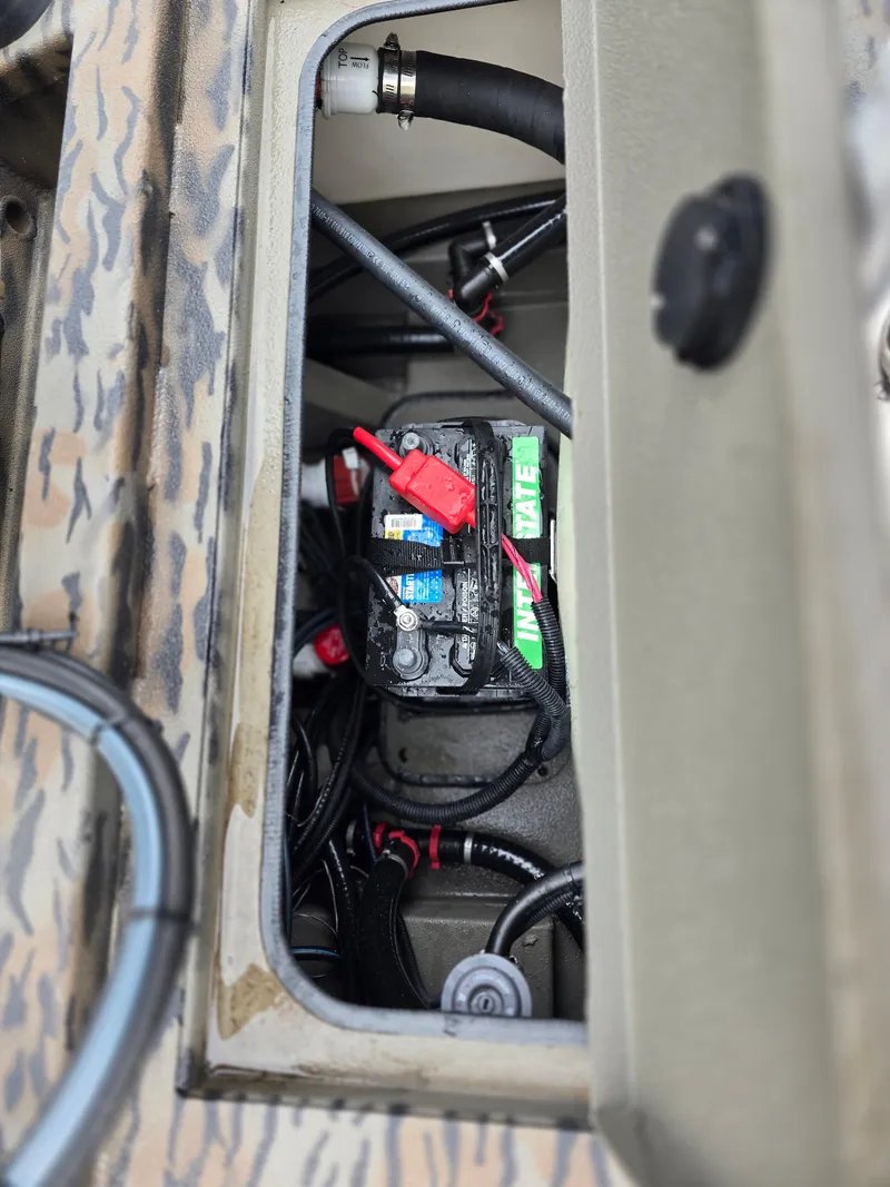 Slide: The Image of Battery compartment of 2025 Xpress H190B boat, showing wiring and connections. - 11