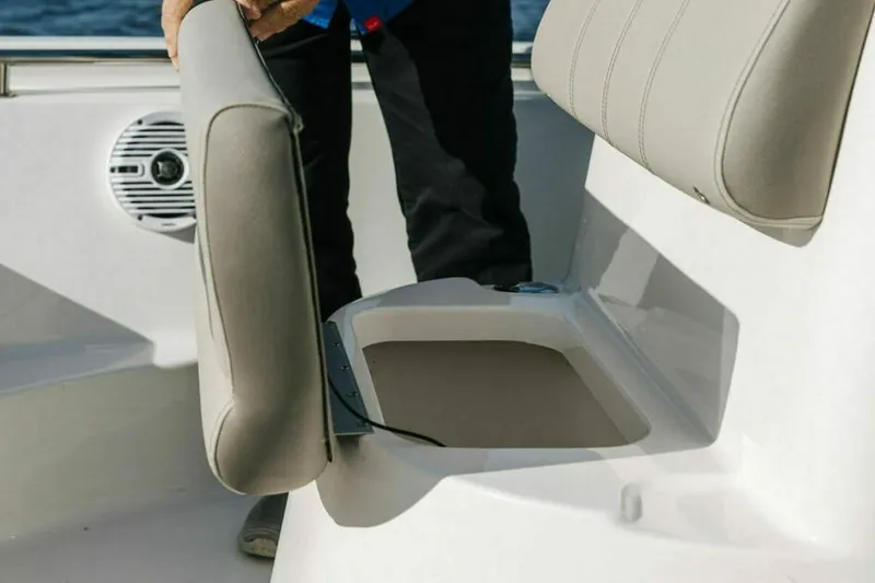 Slide: The Image of 2025 Key West 189 FS boat seat with storage compartment open. - 11