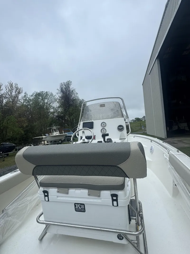Slide: The Image of 2025 Key West 189 FS boat console with steering wheel and gauges, outdoors. - 3