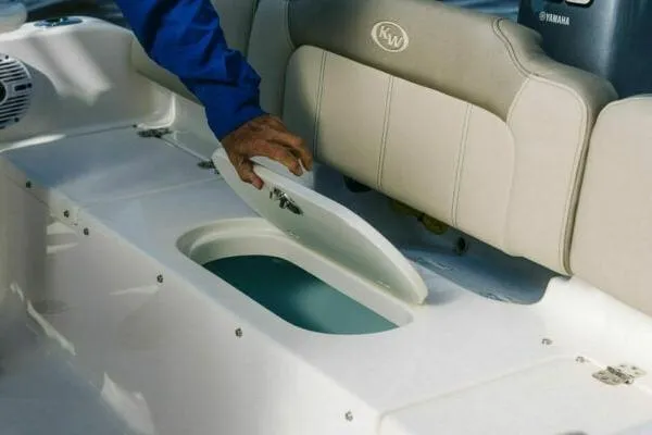 Slide: The Image of 2025 Key West 189 FS boat interior with cooler and seating arrangement. - 8