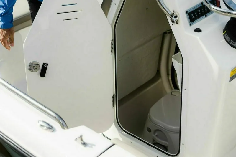 Slide: The Image of 2025 Key West 189 FS boat interior with open storage compartment. - 9