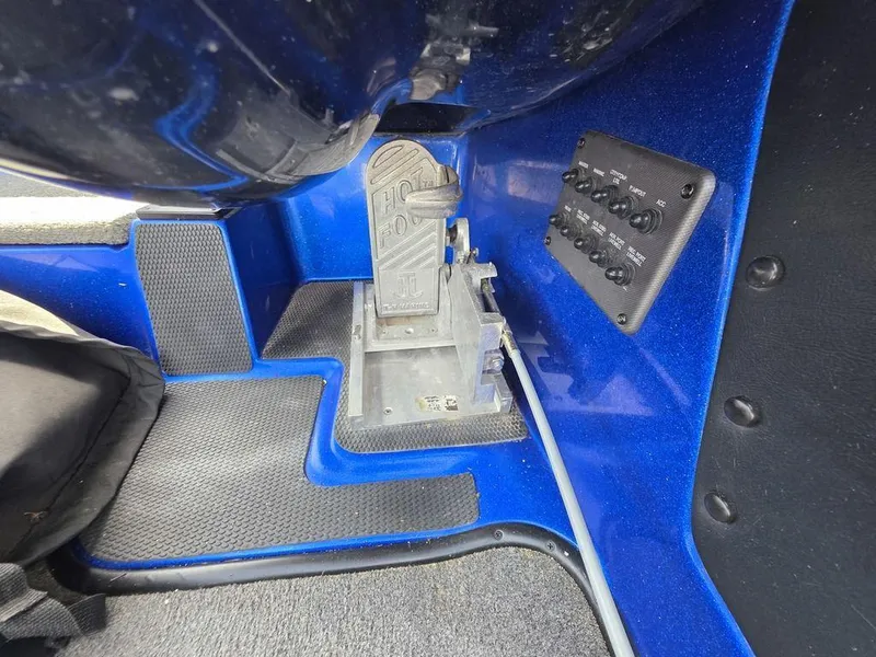 Slide: The Image of 2016 Phoenix 819 Pro boat foot pedal and control panel in blue interior. - 10