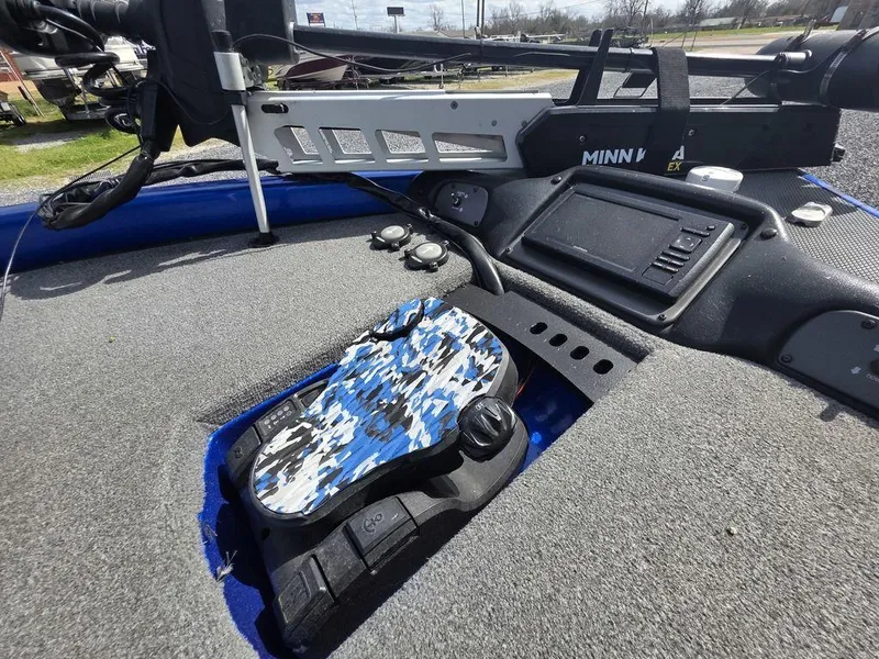 Slide: The Image of 2016 Phoenix 819 Pro boat deck with Minn Kota trolling motor and camo foot pedal. - 12