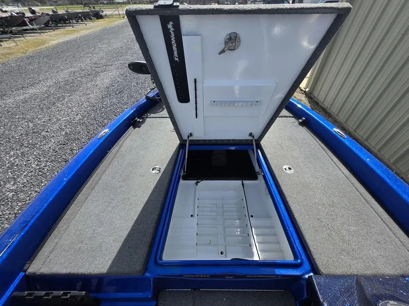 Slide: The Image of 2016 Phoenix 819 Pro boat with open storage compartment, blue and gray interior. - 20