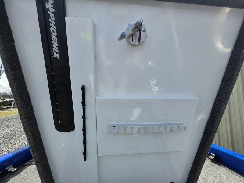 Slide: The Image of 2016 Phoenix 819 Pro boat dashboard with control panel and key switch. - 21