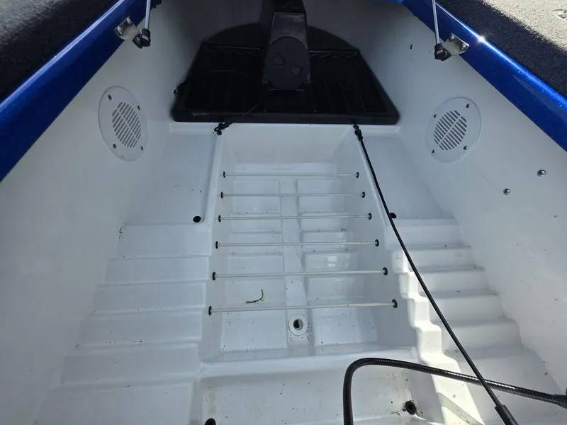 Slide: The Image of Interior view of a 2016 Phoenix 819 Pro boat, featuring a clean, white deck. - 22