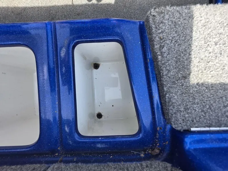 Slide: The Image of Blue and gray interior compartment of a 2016 Phoenix 819 Pro boat. - 26