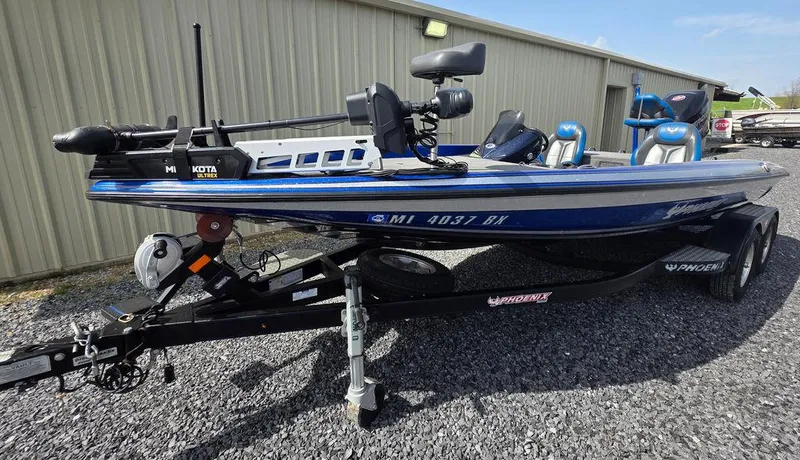 Slide: The Image of 2016 Phoenix 819 Pro fishing boat on trailer, parked outdoors. - 34