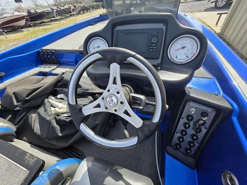 Slide: The Image of 2016 Phoenix 819 Pro boat dashboard with steering wheel and gauges. - 8
