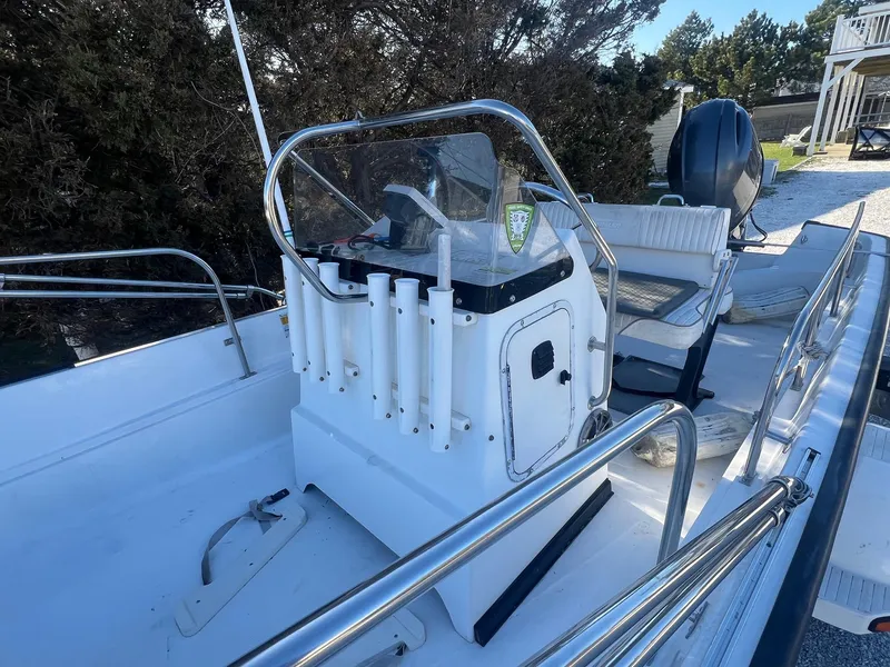 Slide: The Image of 2000 Boston Whaler 17 Montauk boat with center console and rod holders. - 3