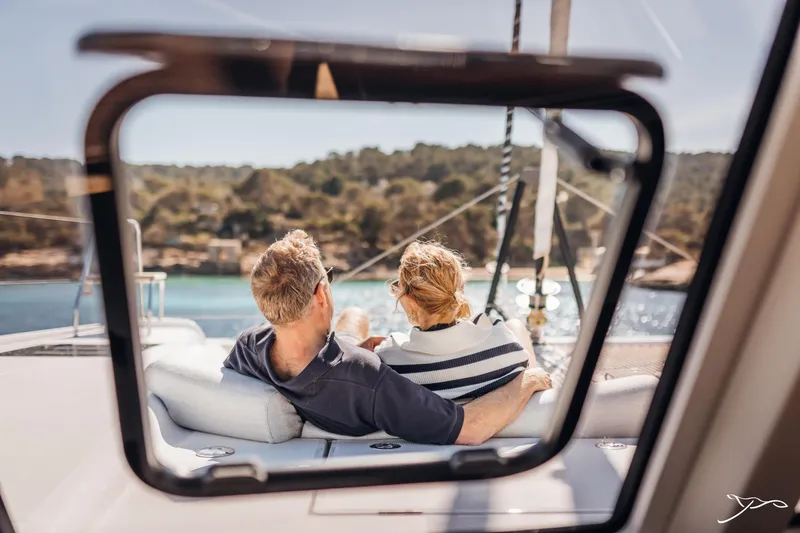 Slide: The Image of Couple relaxing on Nautitech 44 Open yacht, enjoying scenic view through window. - 38
