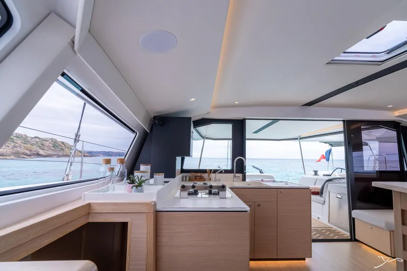 Slide: The Image of Luxurious interior of 2025 Nautitech 44 Open catamaran with modern kitchen and ocean view. - 42