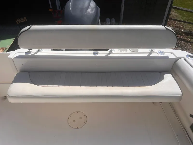 Slide: The Image of 2004 Robalo R225 Walkaround boat seat, white upholstery, rear view. - 17
