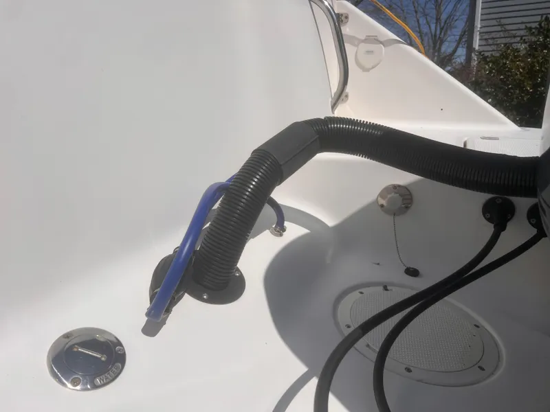 Slide: The Image of 2004 Robalo R225 Walkaround boat interior with wiring and hose details. - 20