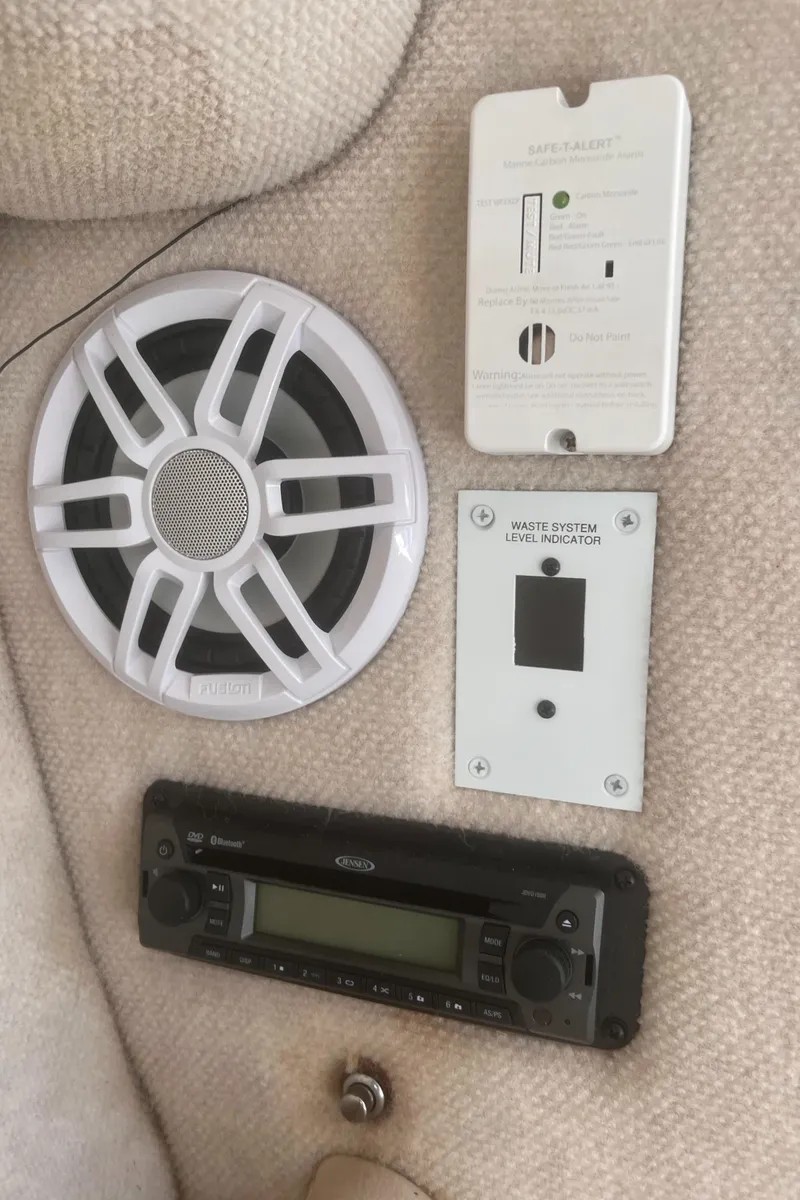 Slide: The Image of 2004 Robalo R225 Walkaround interior with speaker, control panel, and stereo system. - 25