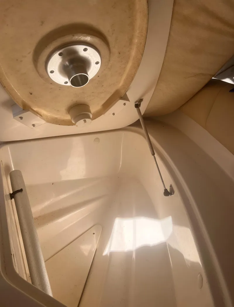 Slide: The Image of 2004 Robalo R225 Walkaround boat interior, showcasing storage compartment and structural details. - 26