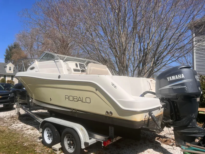 Slide: The Image of 2004 Robalo R225 Walkaround boat on trailer with Yamaha outboard motor. - 3
