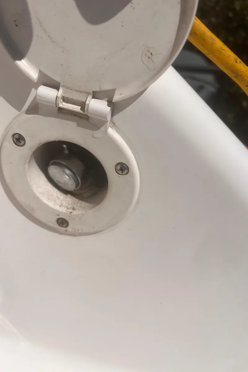 Slide: The Image of 2004 Robalo R225 Walkaround boat fuel cap detail. - 36