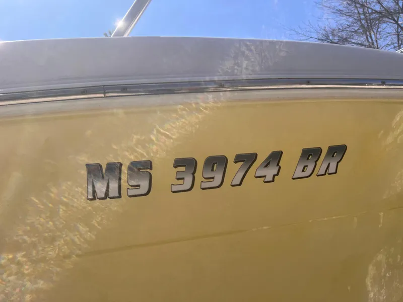 Slide: The Image of 2004 Robalo R225 Walkaround boat with registration number MS 3974 BR. - 4