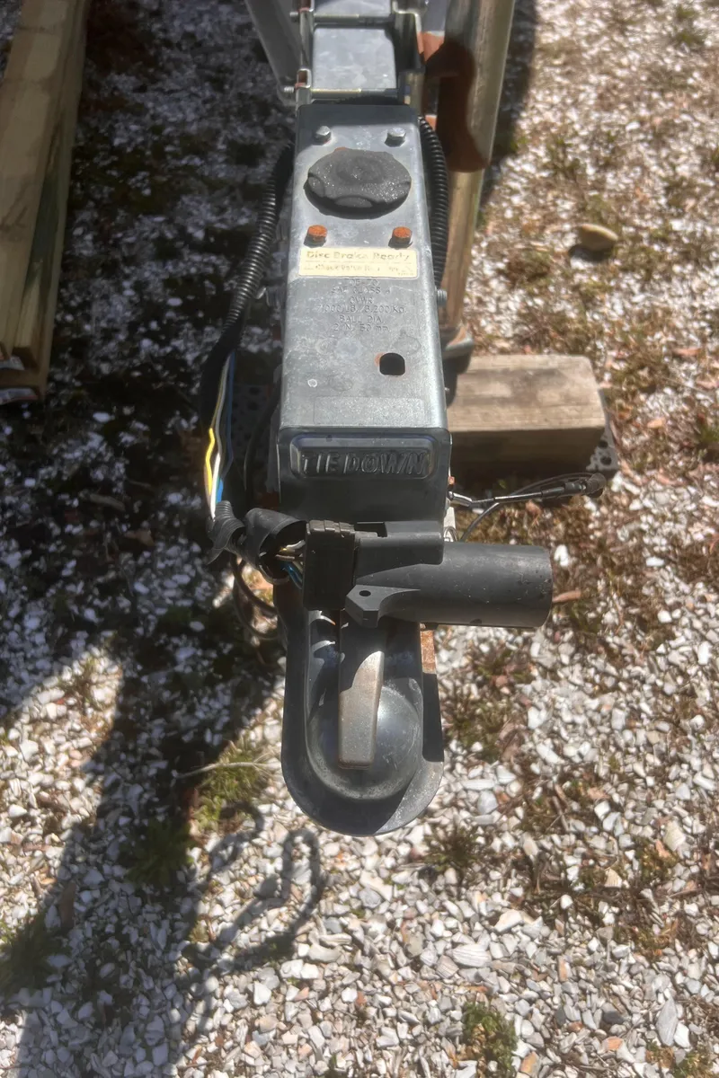 Slide: The Image of Trailer hitch of a 2004 Robalo R225 Walkaround on gravel surface. - 43