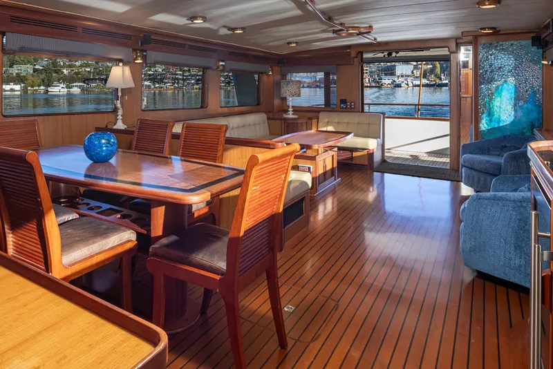Slide: The Image of Luxurious interior of 2003 Marlow 72C yacht with elegant wood furnishings and waterfront view. - 30