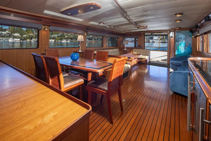 Slide: The Image of Luxurious interior of 2003 Marlow 72C yacht with elegant wood flooring and spacious seating. - 31
