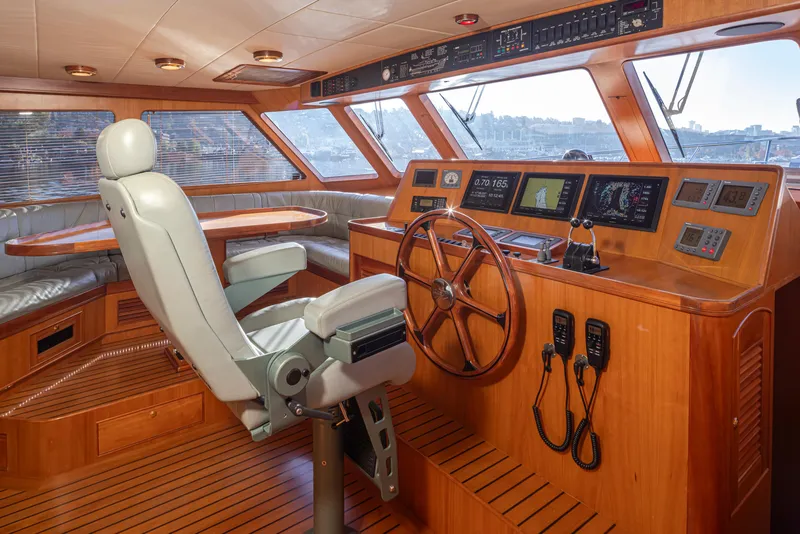 Slide: The Image of Luxurious 2003 Marlow 72C yacht helm with leather seating and advanced navigation controls. - 37