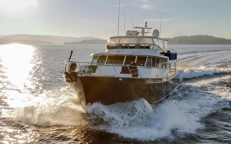 Slide: The Image of Marlow 72C yacht cruising on open water at sunset, 2003 model. - 4