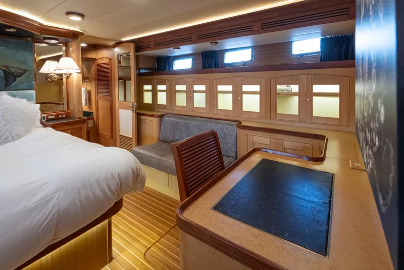 Slide: The Image of Luxurious cabin interior of 2003 Marlow 72C yacht with elegant wood finishes. - 40