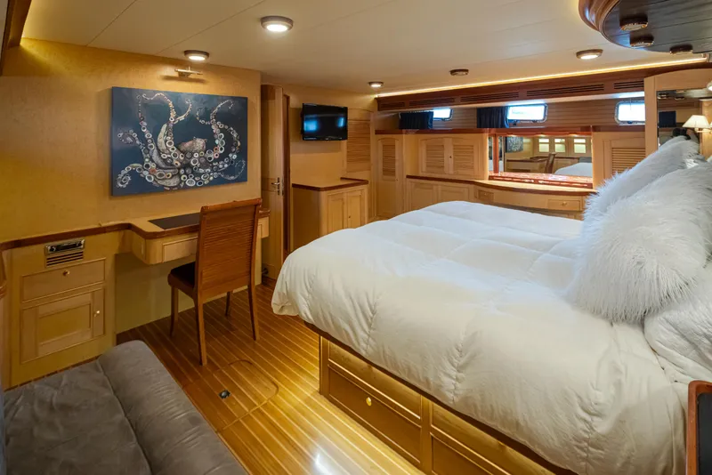 Slide: The Image of Luxurious Marlow 72C yacht bedroom with elegant decor and plush bedding, 2003 model. - 41
