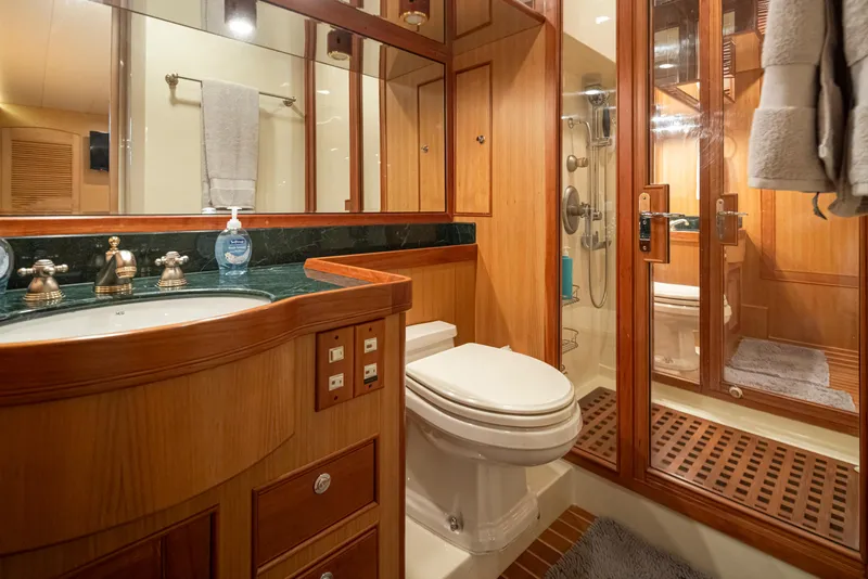 Slide: The Image of Luxurious Marlow 72C 2003 yacht bathroom with wood accents and modern fixtures. - 43