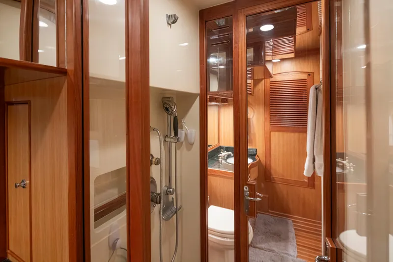 Slide: The Image of Luxurious Marlow 72C 2003 yacht bathroom with wood accents and modern fixtures. - 47