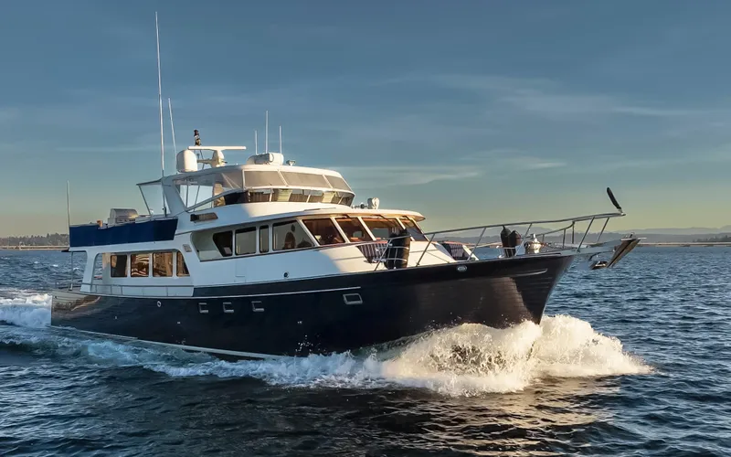 Slide: The Image of Marlow 72C yacht cruising on open water, 2003 model, under clear skies. - 6