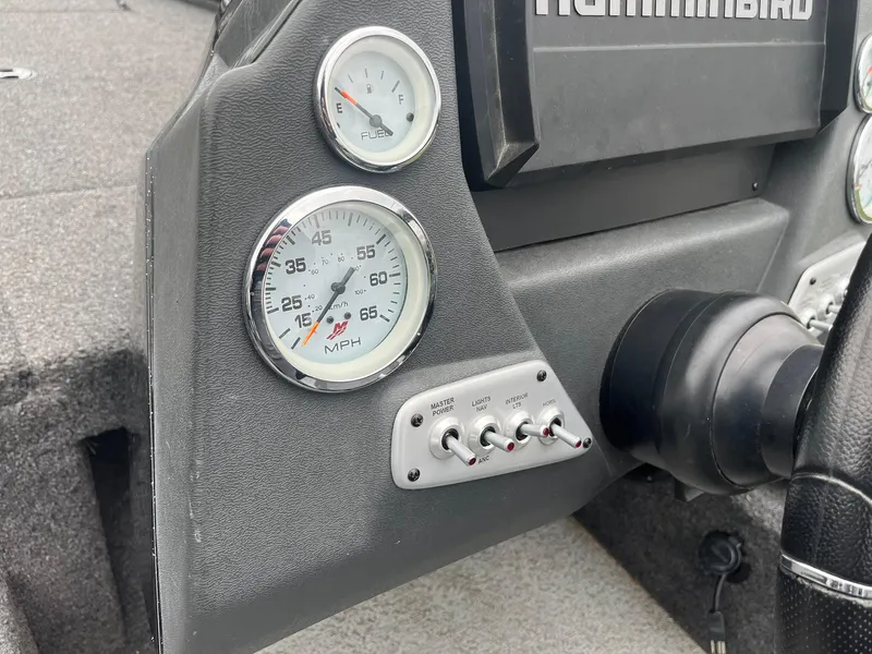 Slide: The Image of Dashboard of 2019 Lund 1875 Pro-V Bass XS with speedometer and controls. - 16