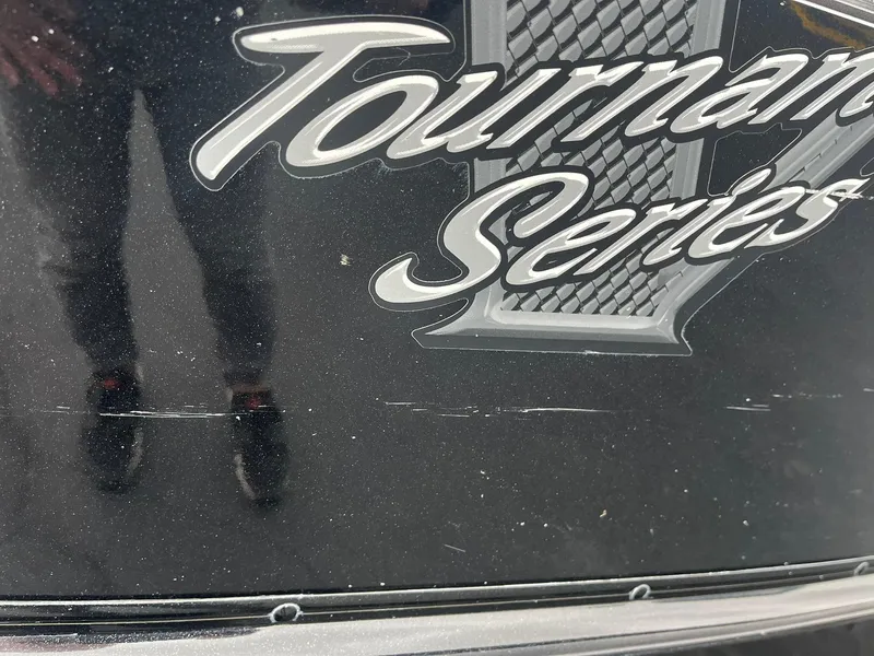 Slide: The Image of Close-up of 2019 Lund 1875 Pro-V Bass XS Tournament Series logo on black surface. - 31