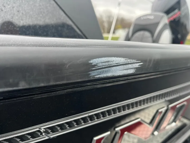 Slide: The Image of 2019 Lund 1875 Pro-V Bass XS boat with visible scratch on the side. - 32