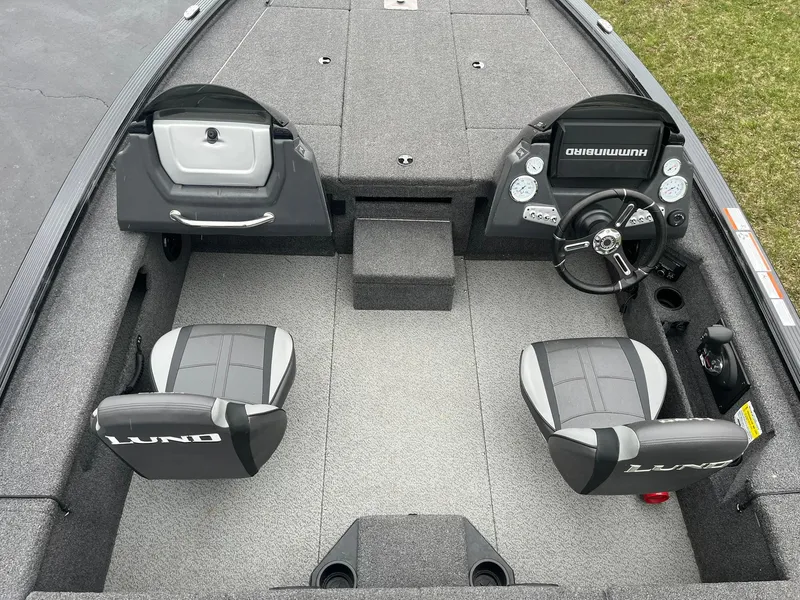 Slide: The Image of 2019 Lund 1875 Pro-V Bass XS boat interior with dual seats and steering console. - 6