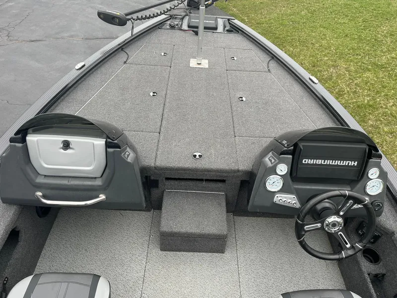 Slide: The Image of 2019 Lund 1875 Pro-V Bass XS boat interior with steering wheel and control panel. - 7