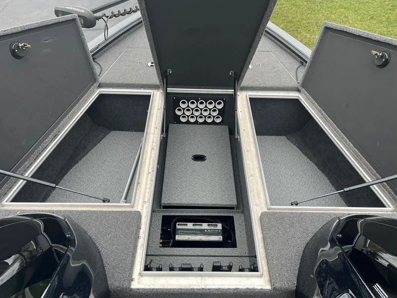 Slide: The Image of 2019 Lund 1875 Pro-V Bass XS boat storage compartments open, showcasing organized interior layout. - 8
