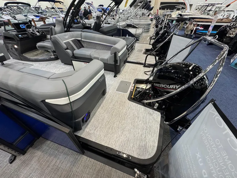 Slide: The Image of 2025 Bennington 22 MFB boat interior with Mercury engine, showcasing sleek seating and modern design. - 11