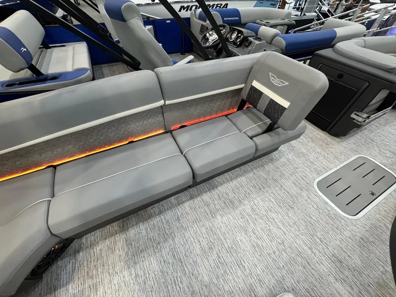 Slide: The Image of 2025 Bennington 22 MFB boat interior with gray seating and ambient lighting. - 12