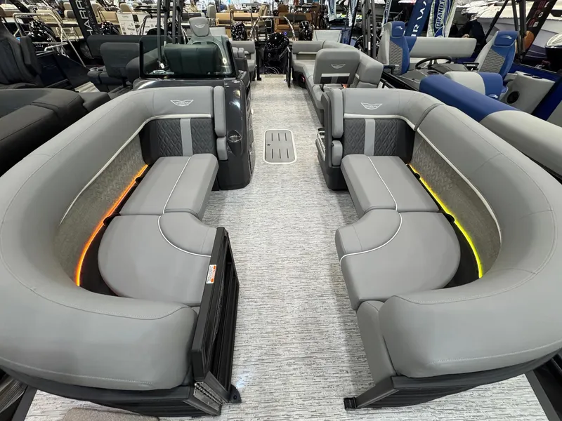 Slide: The Image of 2025 Bennington 22 MFB boat interior with gray seating and ambient lighting. - 5