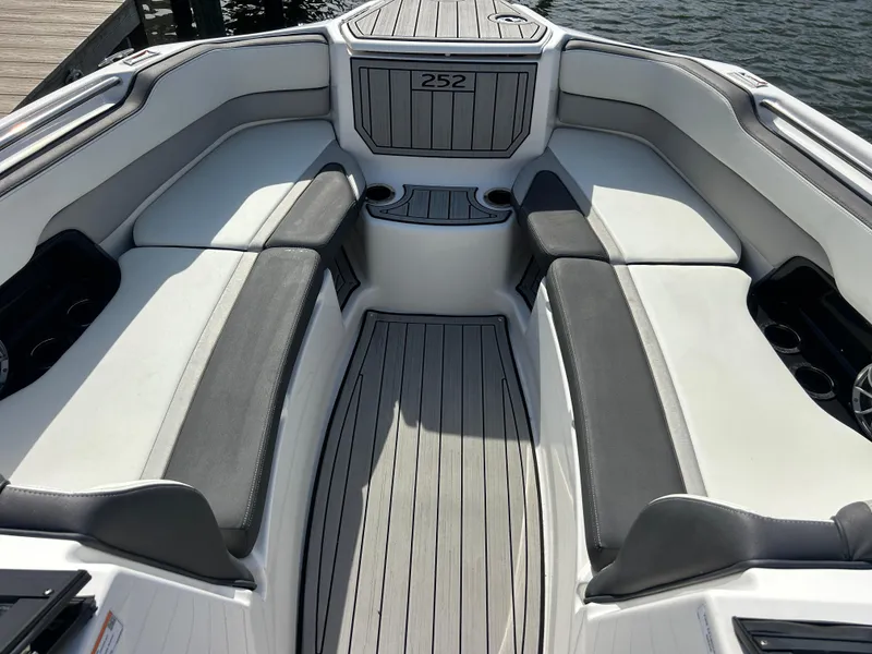 Slide: The Image of 2023 Yamaha Boats 252SD interior with sleek seating and modern design. - 16