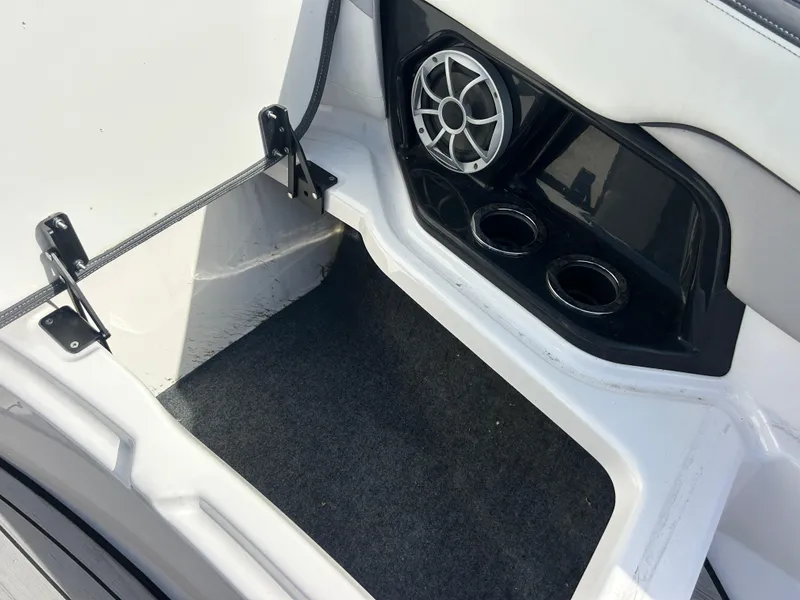 Slide: The Image of 2023 Yamaha Boats 252SD interior with speaker and cup holders. - 20