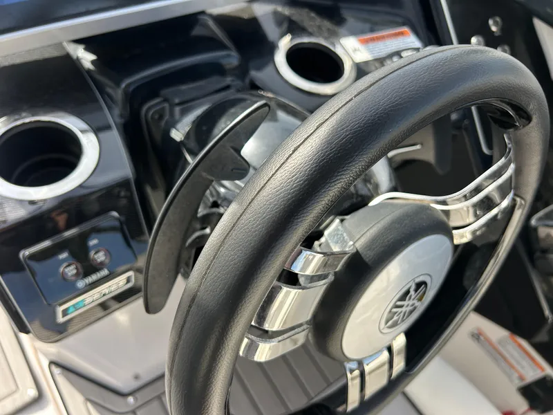 Slide: The Image of 2023 Yamaha Boats 252SD steering wheel and dashboard close-up. - 28